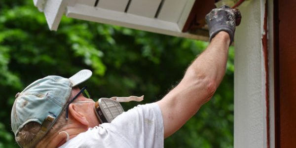 a-man-painting-house-exterior-with-white-color-2022-11-11-10-52-52-utc